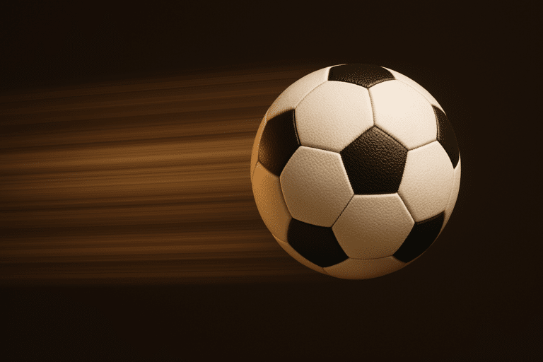 Image shows a speeding football flying through the air.