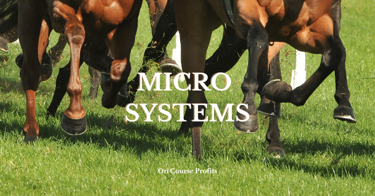 Image if horses racing on turf, hooves and grass.