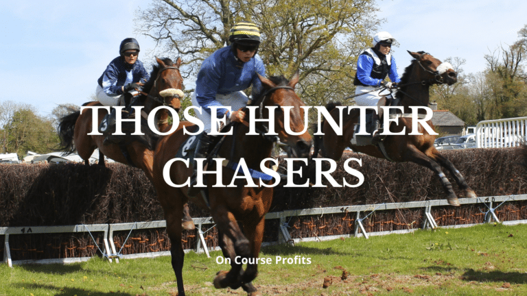 Image of three horses in a race jumping a fence.