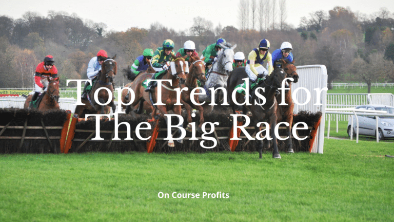 Horses jumping a hurdle in a race.