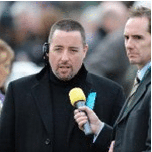Rory Delargy of the Racing Consultants horse racing tipping service being interviewed wearing a headset wiith a big yellow microphone