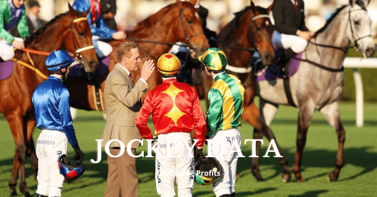 jockey's standing in a parade ring talking to a trainer.